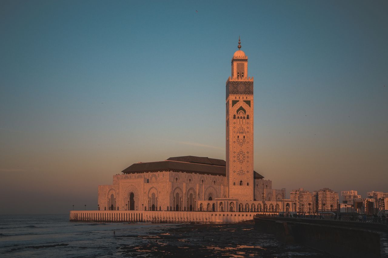 services-08 Stunning view of Hassan II Mosque against the sunset sky in Casablanca, Morocco.